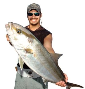 Daniel Felsher is all smiles after winning a pitched battle with this amberjack.