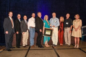 Richard Taylor and partner Suzie Paris accepting award.