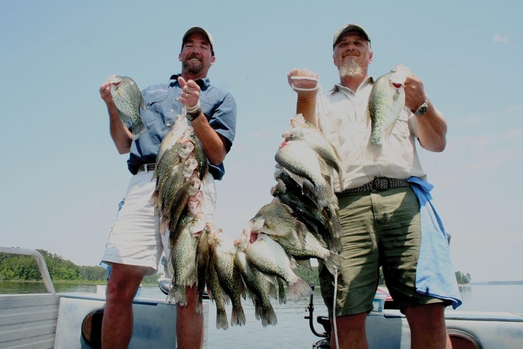 Guides Roger Bacon and Ronnie Burnett with a huge strap of crappie caught on Sam Rayburn.