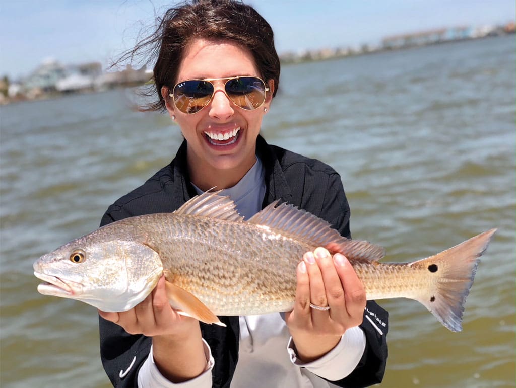 Kelley Bergeson caught this redfish near Tiki Island in Galveston while fishing with her dad, Bruce. She is thankful her dad taught her to love the outdoors.