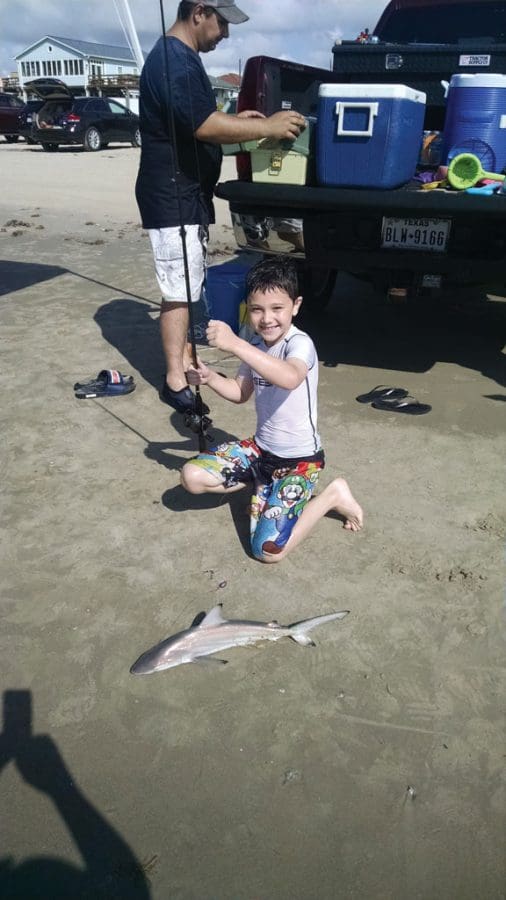 First time to surf fish with his Dad, Konnor Bittner, age nine, caught this blacktip shark off Surfside Beach.