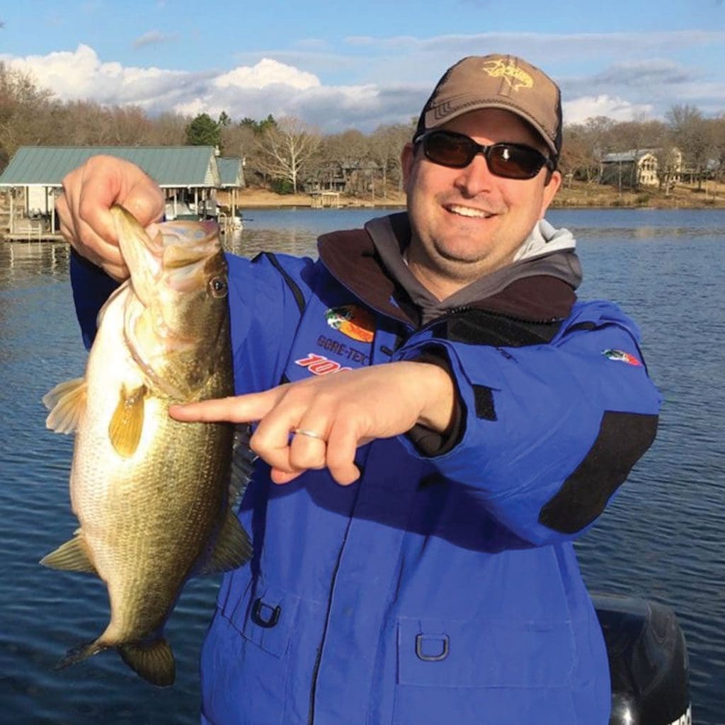 Bryan Lewis of Crandall was reeling in this five pounder at Lake Athens when a much larger bass attacked the fish and engulfed its entire head. The bigger fish, estimated to be in the “double digits” by Lake Athens fishing guide Jim Brack, released the smaller fish in plain view at the side of the boat.