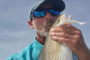 kissing a red drum