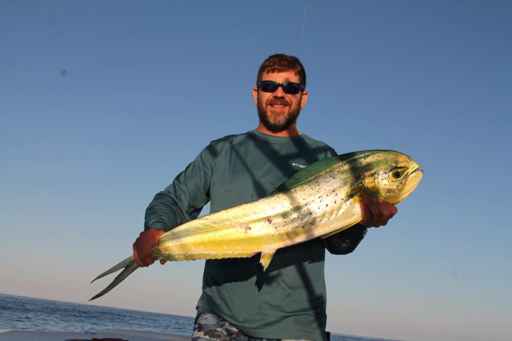 angler with a mahi-mahi