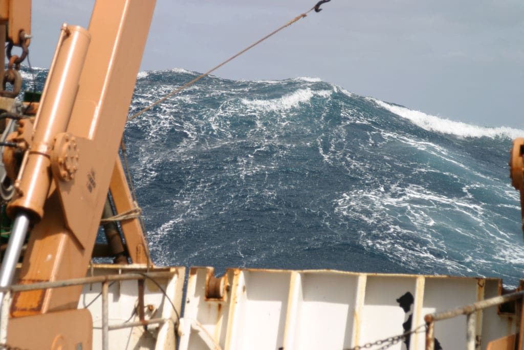 A massive wave towers over a NOAA research vessel. The Gulf can get mean-fast!
