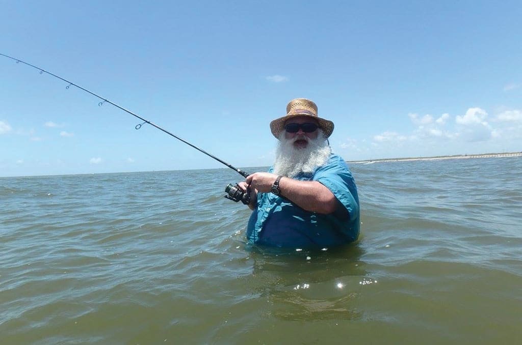 Marcus Heflin of Christian Surf Fishing Adventures, pictured here, had a big hammerhead swim right past him while wadefishing Sea Rim State Park. Sharks aren’t usually out to get people but you need to be cautious in their domain.