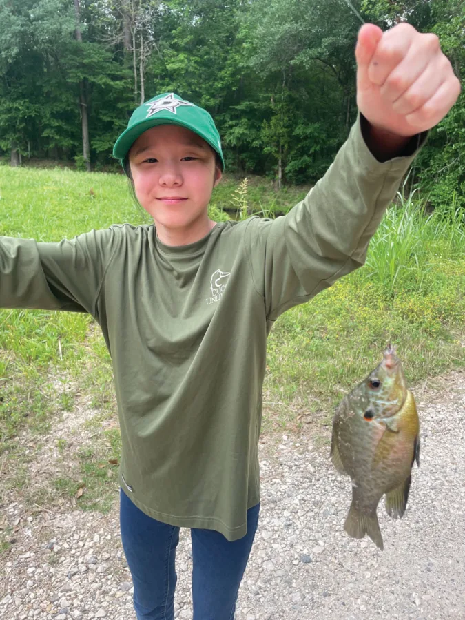 Faith Moore caught this big redear sunfish in a backwoods slough.