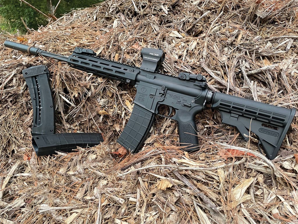 The Tippmann M4-22 looks and handles just like a full sized AR. The 25 round proprietary magazines are easy to load by just sliding (or removing) the outer sleeve as shown here)