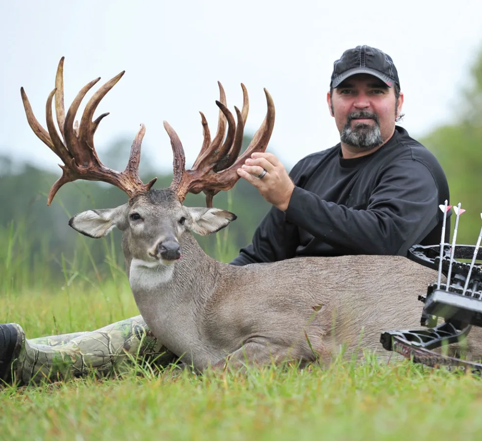 AJ Downs of Conroe with the 27-point, 256-7/8 Boone & Crockett scoring buck he took with a bow back in 2012.
