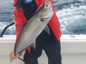 angler with an amberjack