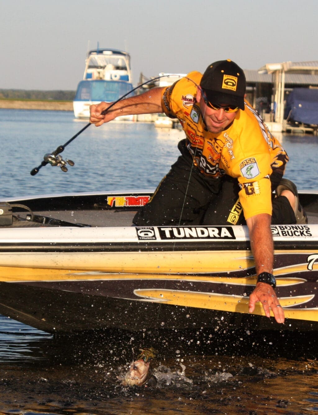 Over the years many top bass pros have fished Lake Conroe. Here Gerald Swindle catches a big one near a marina dock.
