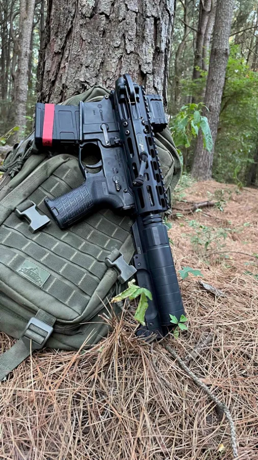 A suppressed 9” 300 Blackout FoldAR upper in folded position fits nicely in this small backpack and deploys in just seconds from its compact package.