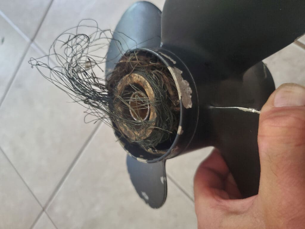 boat propeller twisted with fishing line