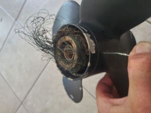 boat propeller twisted with fishing line