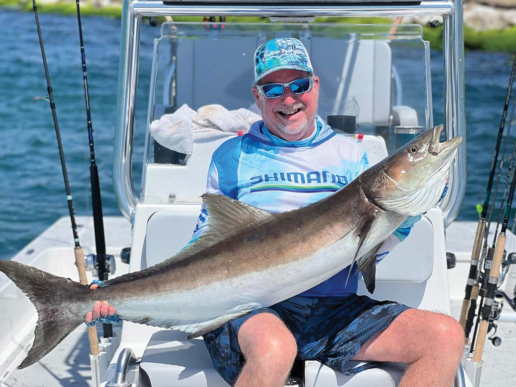Skip Crosby is all smiles with a 51 pound cobia he caught at the South Padre Island jetties with Capt. Brian Barrera. These fish put up a fun and rewarding battle, leaving anglers wanting more.