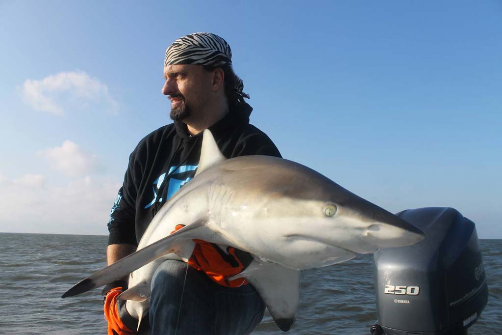 The author with a large blacktip shark he caught and released near the jetties at Southwest Pass, Louisiana.