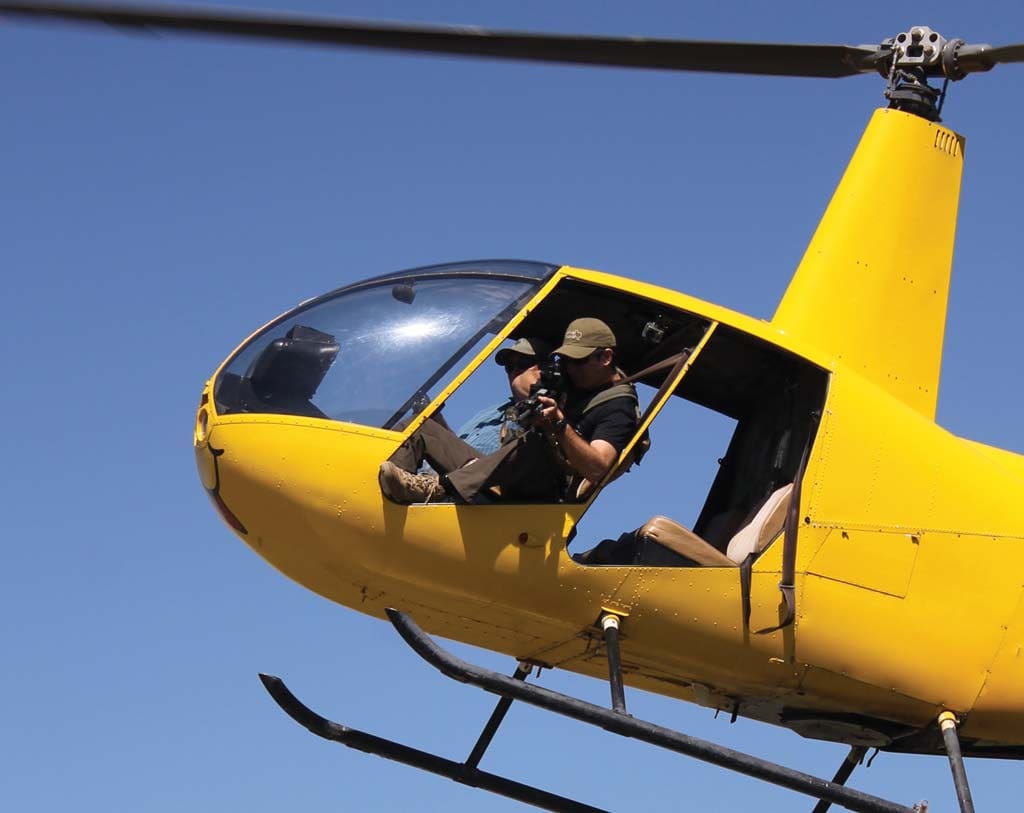 Fish & Game Firearms Editor Dustin Ellermann takes aim on a chopper hog hunt in Matagorda County.