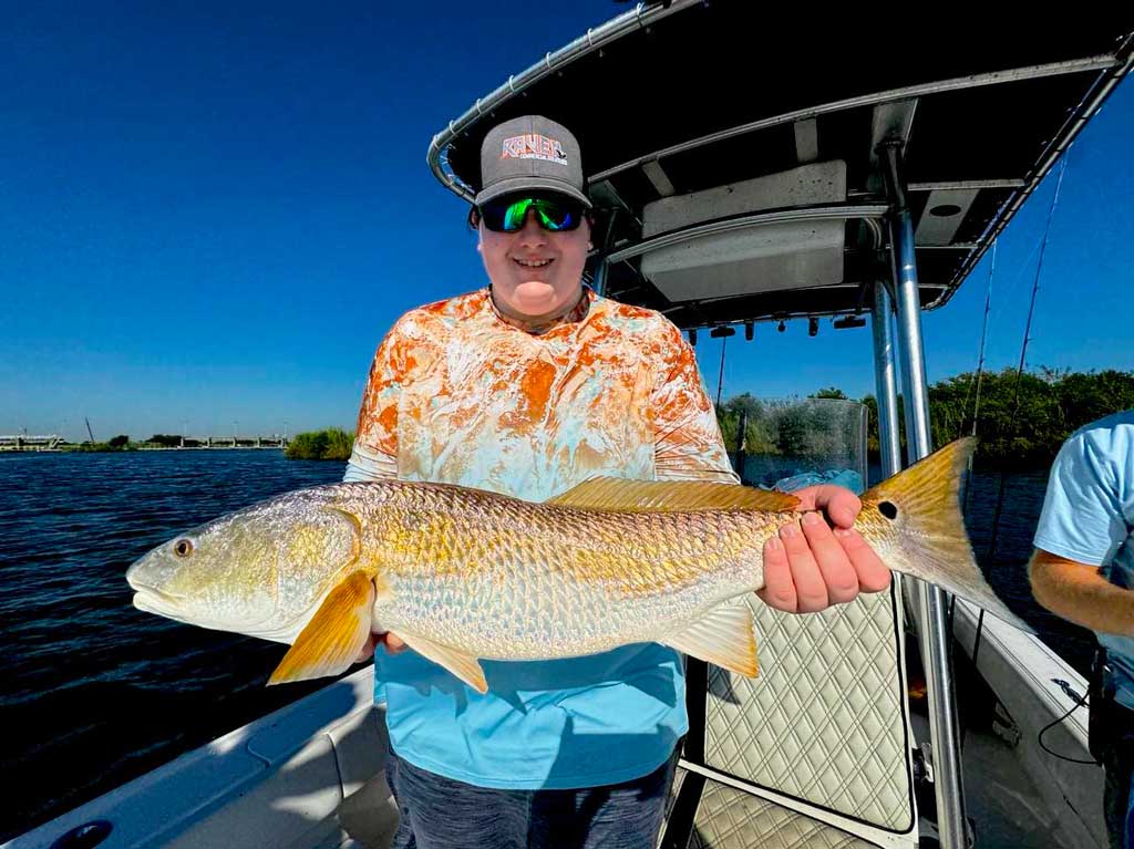 Angler Wyatt Pelt shows off a nice, healthy redfish.