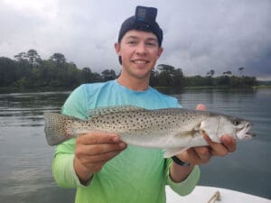 angler with a speckled trout